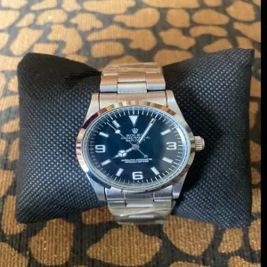 Silver Rolex watch